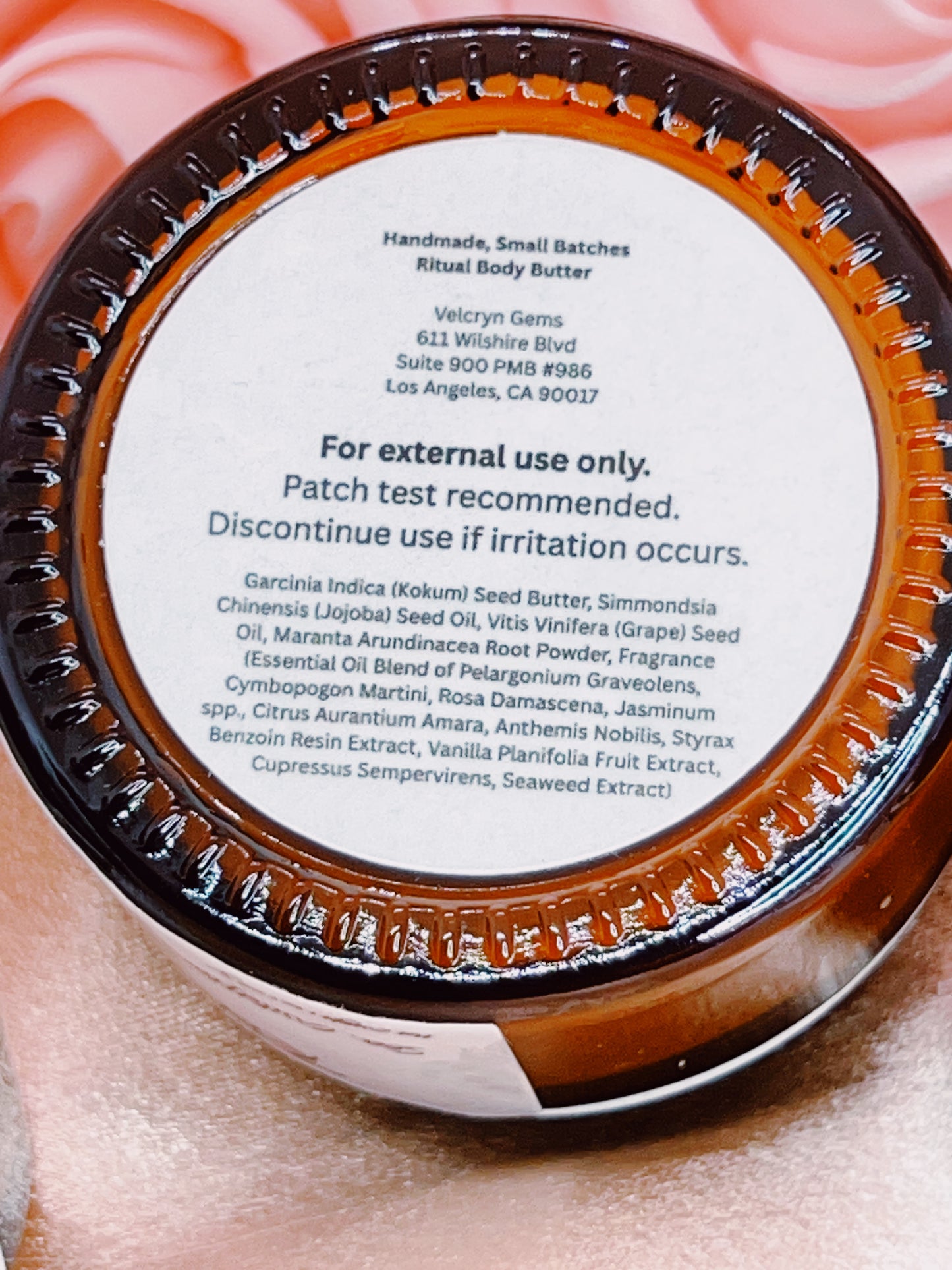 Close-up of a container lid with text and branding details.