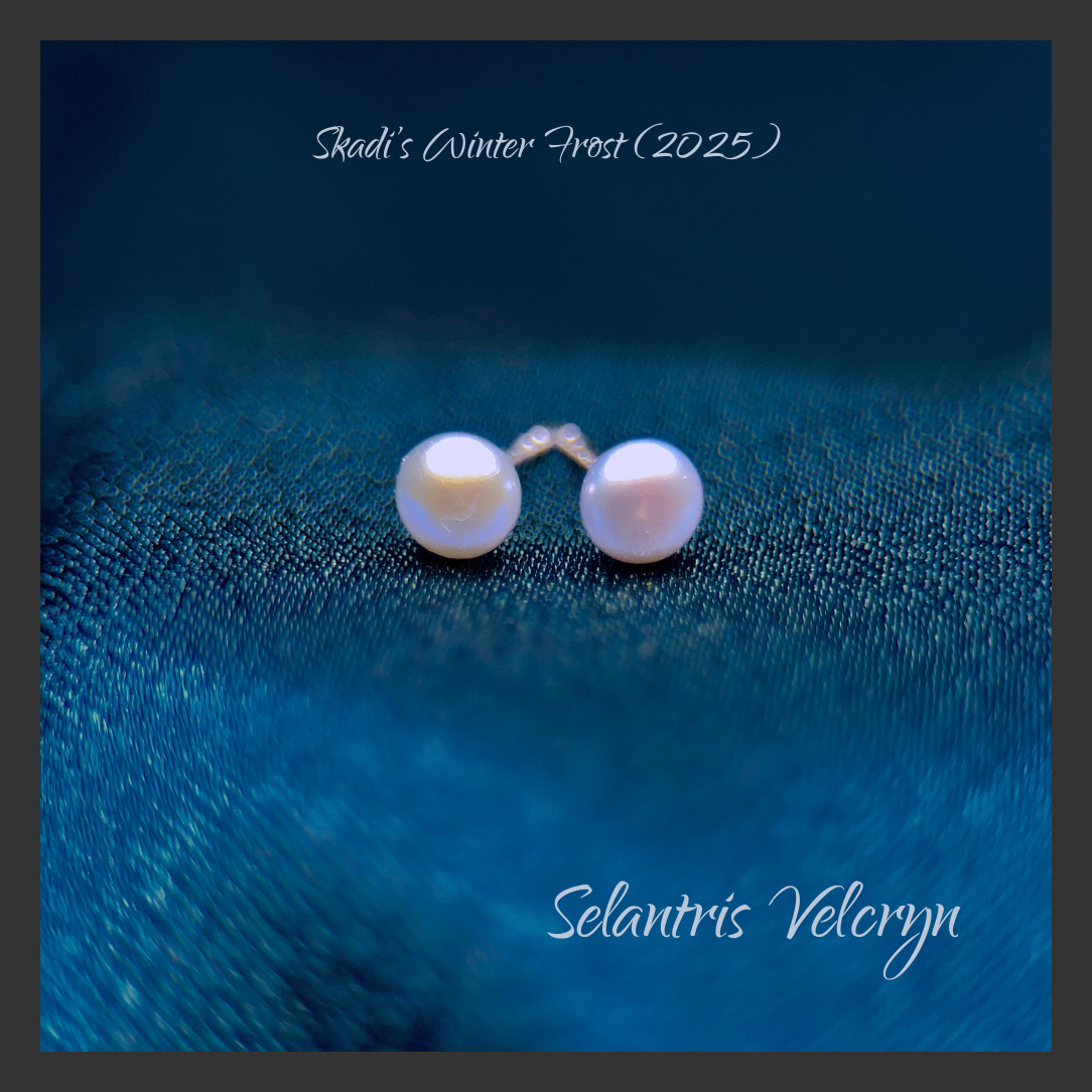 Square promo image on deep frost-blue textured fabric. Two small pale blue-white pearl stud earrings sit near the top center with soft highlights and a faint warm reflection. Script text at the top reads “Skadi’s Winter Frost (2025),” and at the bottom reads “Selantris Velcryn.”