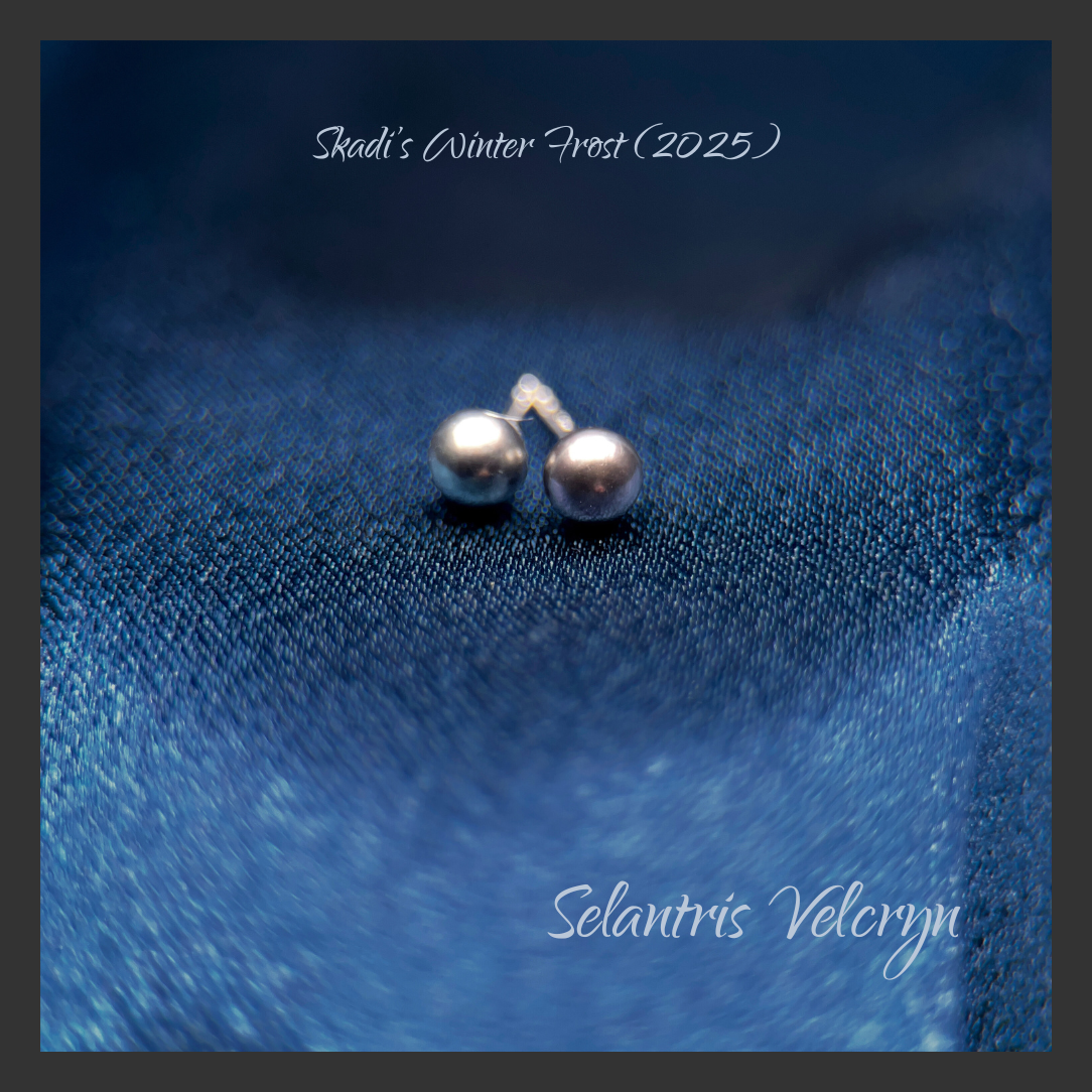 Square promo image on a deep, icy-blue textured fabric background. Two small peacock freshwater  pearl stud earrings sit near the center with a soft, frosty blur around them. Pale script text at the top reads “Skadi’s Winter Frost (2025),” and at the bottom reads “Selantris Velcryn.”