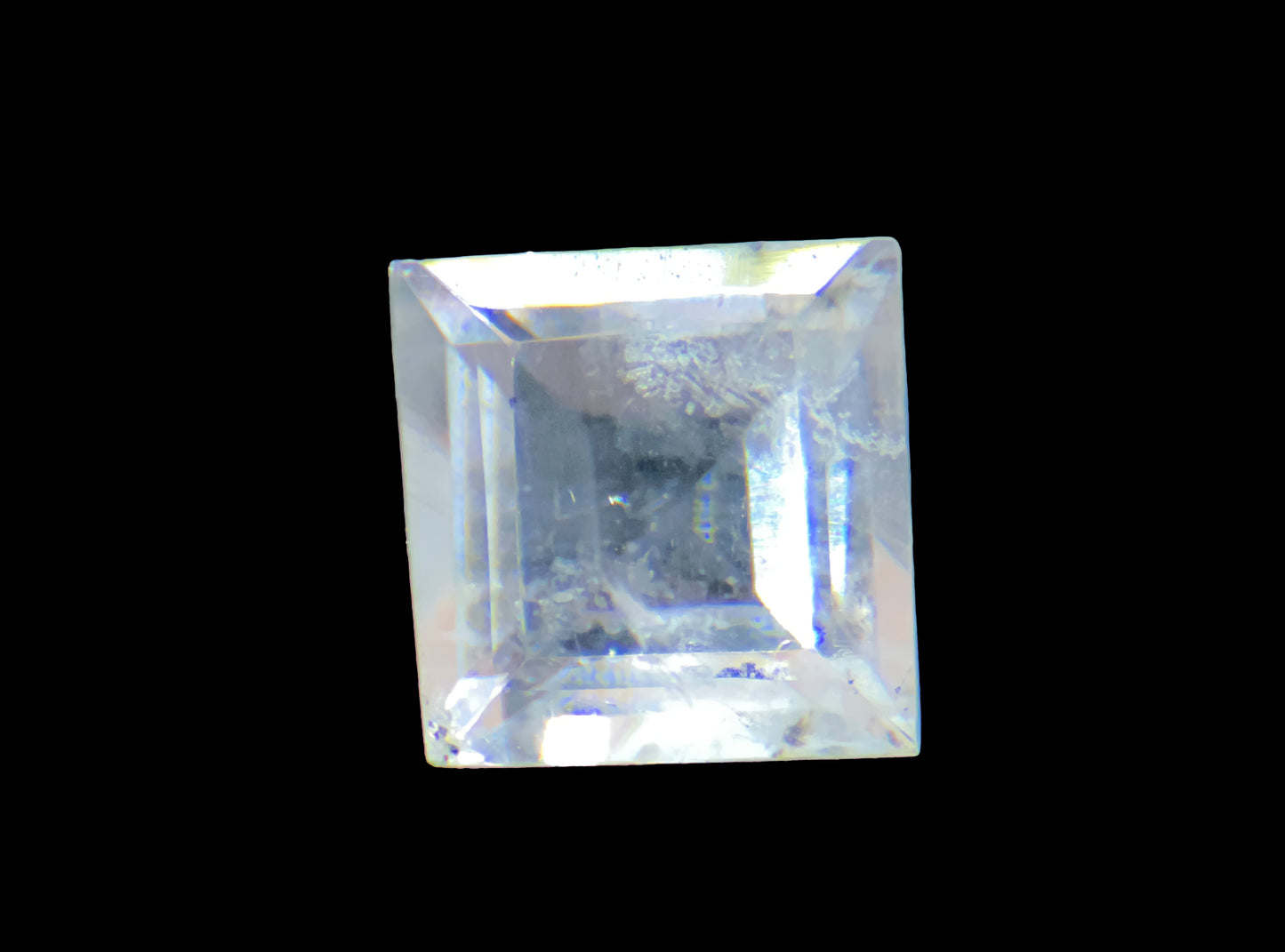 Square-cut gemstone on a black background
