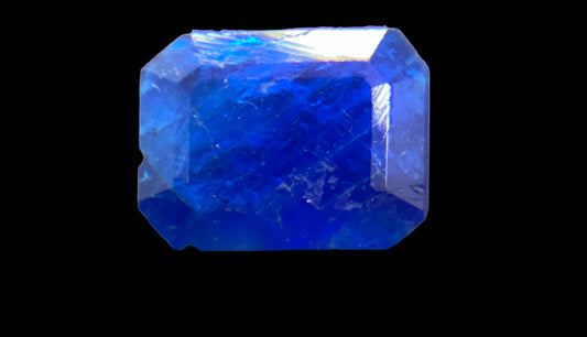 Blue gemstone on a black background